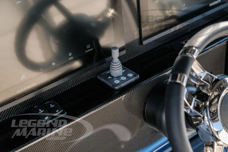 Slide: The Image of 2025 Nor-Tech 340 Sport dashboard with Garmin displays and joystick control. - 16