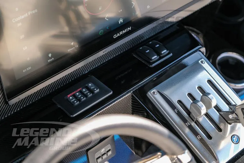 Slide: The Image of 2025 Nor-Tech 340 Sport dashboard with Garmin display and controls. - 17