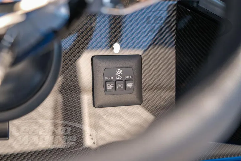 Slide: The Image of 2025 Nor-Tech 340 Sport dashboard with carbon fiber finish and control panel. - 18