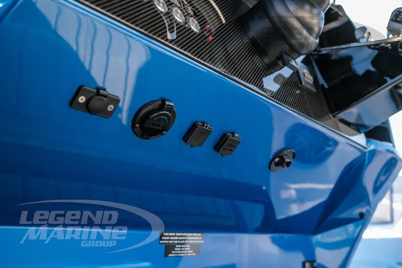 Slide: The Image of 2025 Nor-Tech 340 Sport boat dashboard with controls and Legend Marine Group logo. - 19