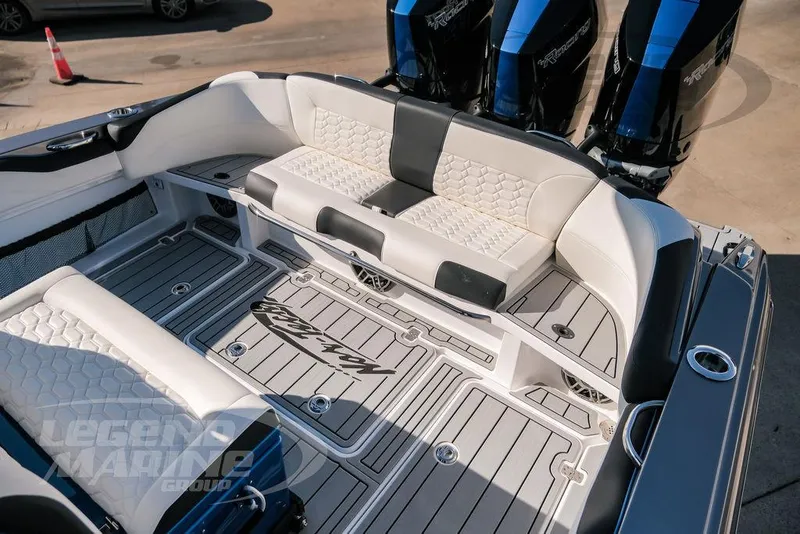 Slide: The Image of 2025 Nor-Tech 340 Sport boat interior with cushioned seating and sleek design. - 27