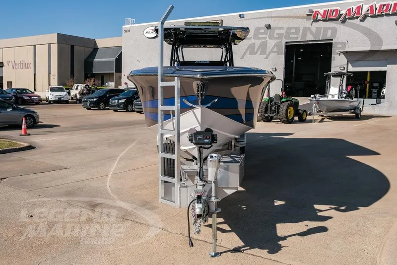 Slide: The Image of 2025 Nor-Tech 340 Sport boat displayed at a dealership. - 3