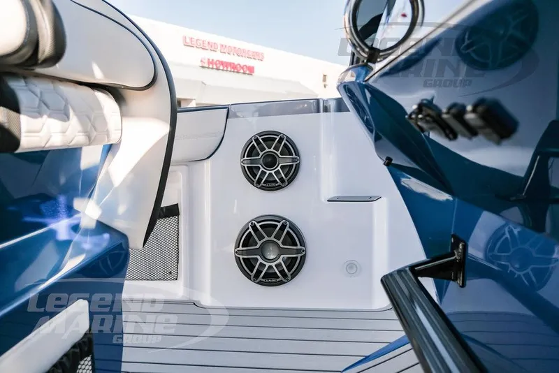 Slide: The Image of 2025 Nor-Tech 340 Sport boat interior with speakers and sleek blue design. - 30