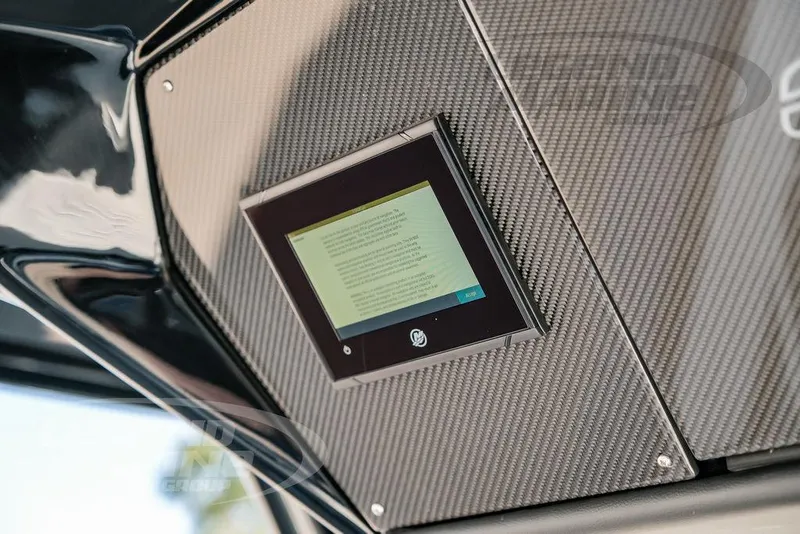 Slide: The Image of Carbon fiber dashboard with touchscreen on 2025 Nor-Tech 340 Sport boat. - 34