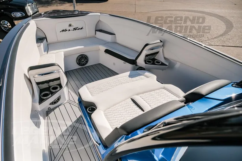Slide: The Image of 2025 Nor-Tech 340 Sport boat interior with luxurious seating and modern design. - 36