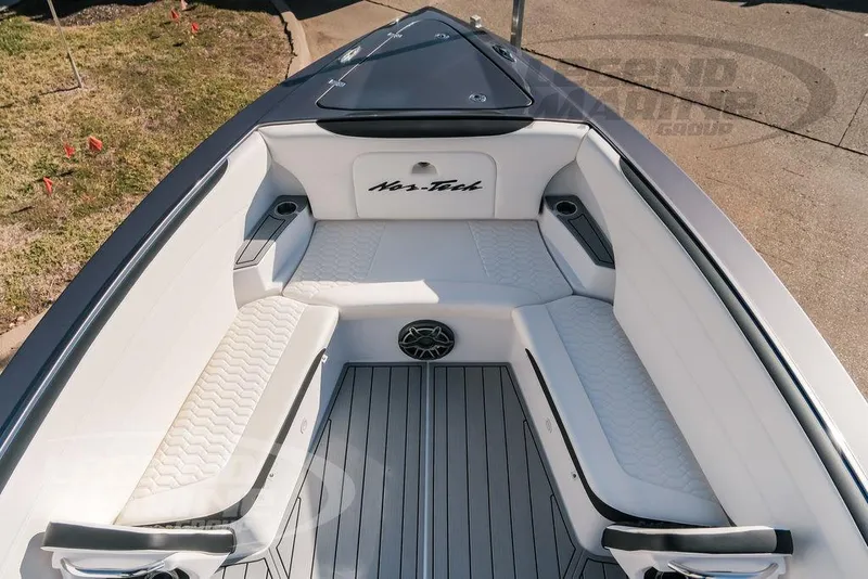 Slide: The Image of 2025 Nor-Tech 340 Sport boat interior with white seating and sleek design. - 37