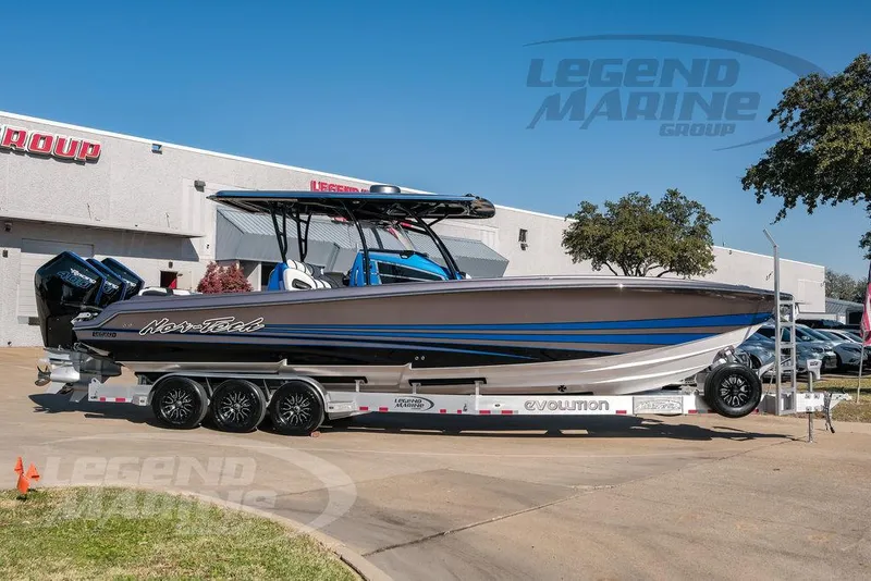 Slide: The Image of 2025 Nor-Tech 340 Sport boat on trailer at Legend Marine Group dealership. - 4