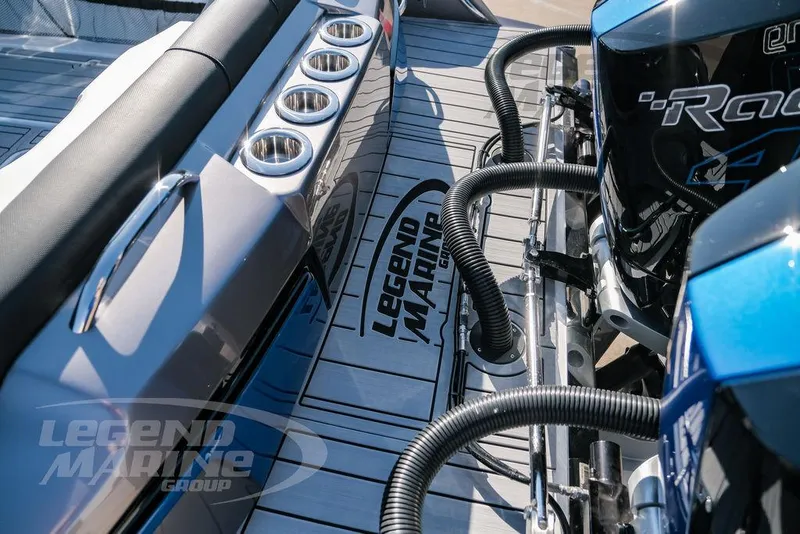 Slide: The Image of 2025 Nor-Tech 340 Sport boat deck with Legend Marine branding and powerful engines. - 43