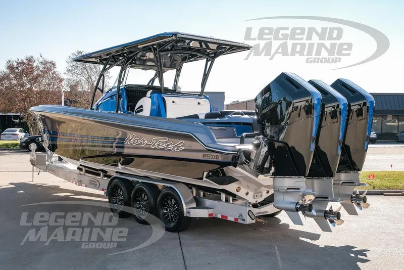 Slide: The Image of 2025 Nor-Tech 340 Sport boat with triple engines on a trailer. - 7