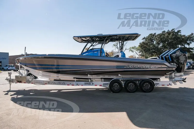 Slide: The Image of 2025 Nor-Tech 340 Sport boat on trailer, sleek design, triple engines, Legend Marine Group. - 8