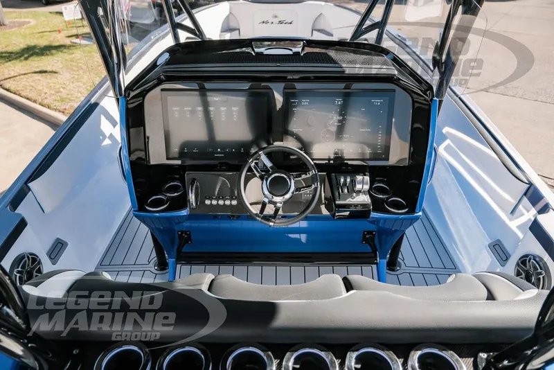 Slide: The Image of 2025 Nor-Tech 340 Sport boat dashboard with advanced controls and sleek design. - 9
