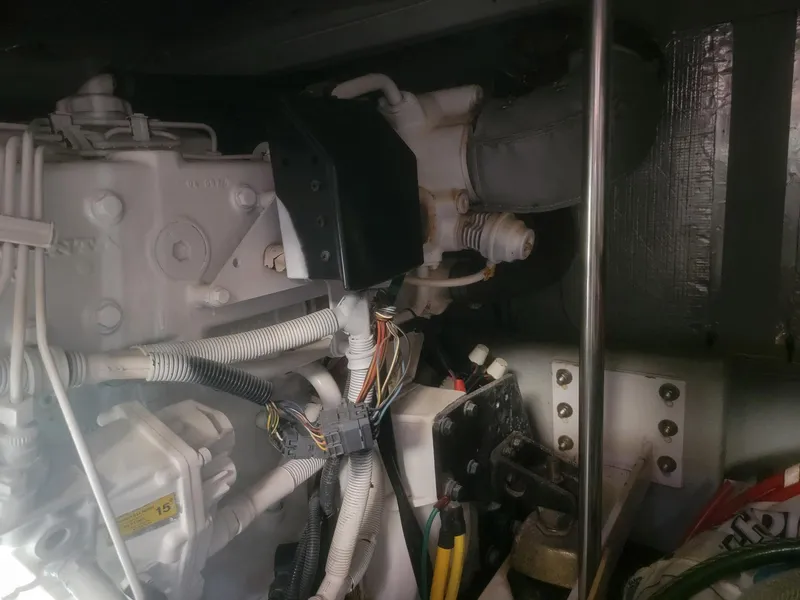 Slide: The Image of Engine compartment of 2005 Silverton 43 Motor Yacht with visible wiring and components. - 18