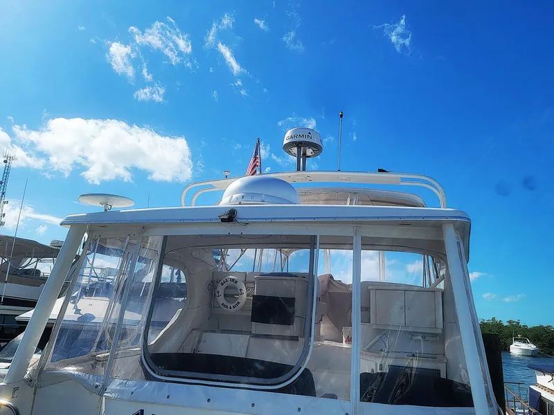 Slide: The Image of 2005 Silverton 43 Motor Yacht under clear blue sky at marina. - 19