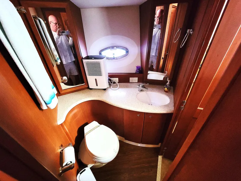 Slide: The Image of Luxurious bathroom in 2005 Silverton 43 Motor Yacht with modern amenities and wood finishes. - 6