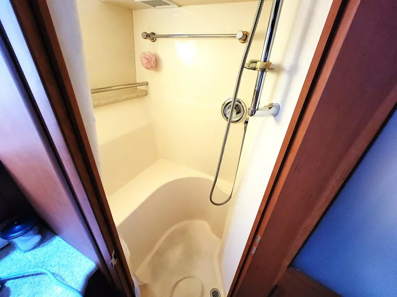 Slide: The Image of Shower area in 2005 Silverton 43 Motor Yacht, featuring modern fixtures and compact design. - 9