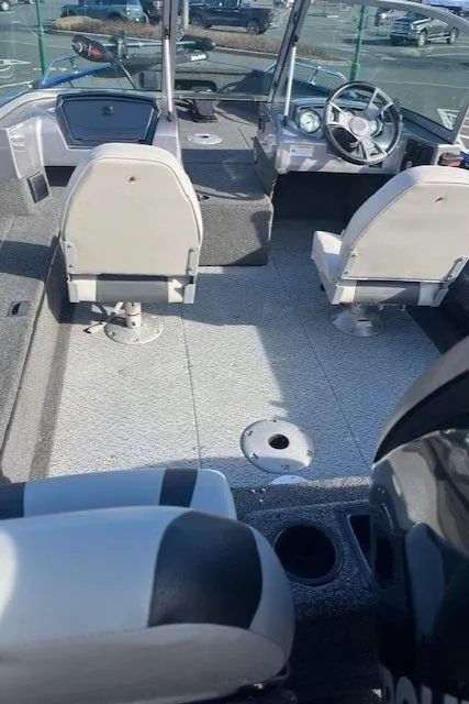 Slide: The Image of 2014 Lowe Fishing Machine FM165WT interior with seating and steering console. - 3