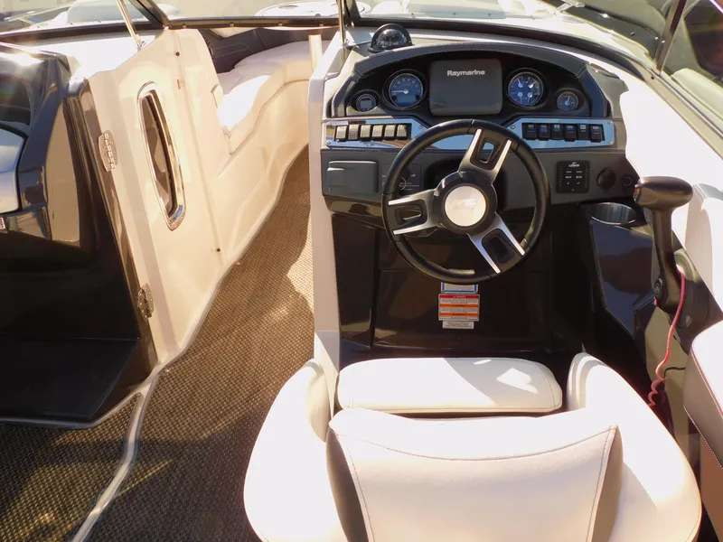 Slide: The Image of 2014 Monterey 268 Super Sport boat interior with steering wheel and dashboard controls. - 30