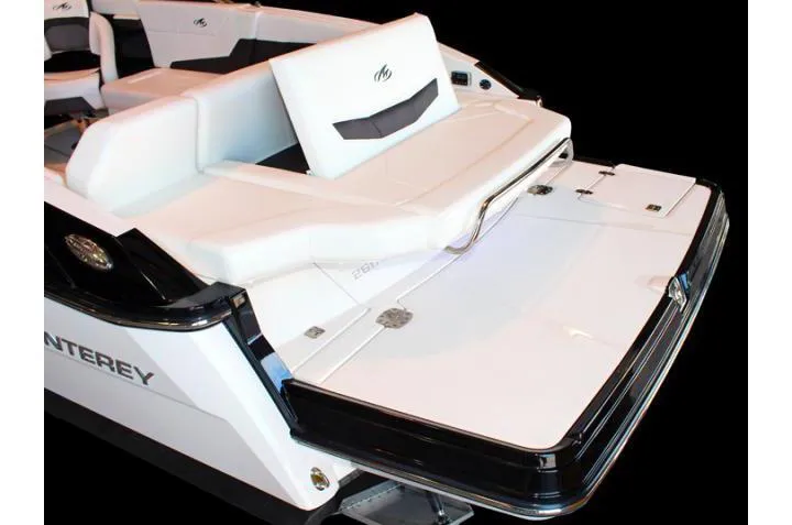 Slide: The Image of 2014 Monterey 268 Super Sport boat with sleek white seating and swim platform. - 74