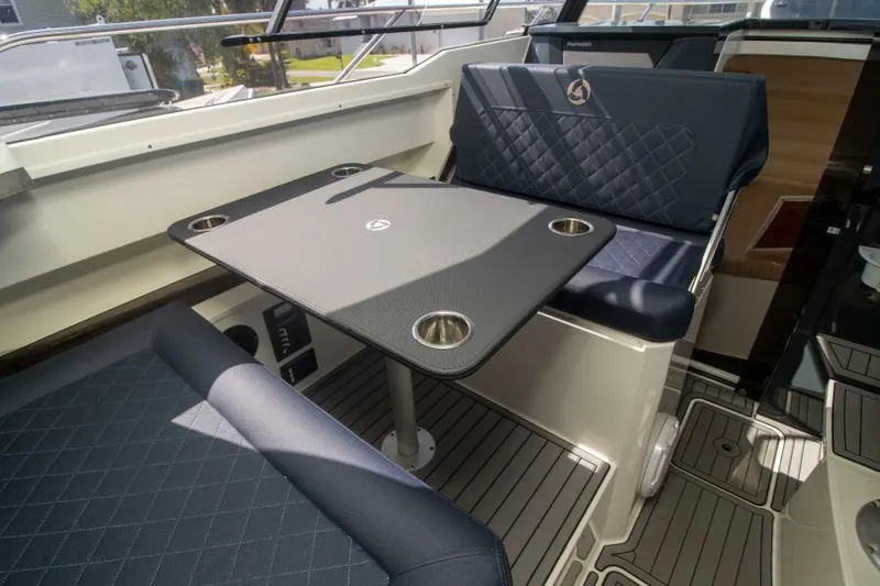 Slide: The Image of 2024 Skamander 920 Explorer Max interior with stylish seating and table setup. - 25