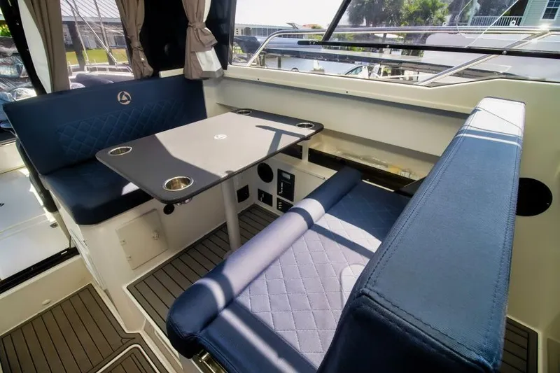 Slide: The Image of 2024 Skamander 920 Explorer Max interior with blue seating and table. - 27