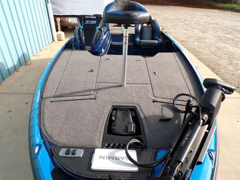 Slide: The Image of 2025 Nitro Z18 Pro fishing boat deck with Garmin equipment, blue exterior. - 9