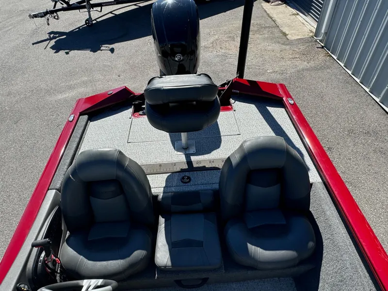 Slide: The Image of 2020 Bass Tracker 175 TF boat interior with three seats and motor. - 10