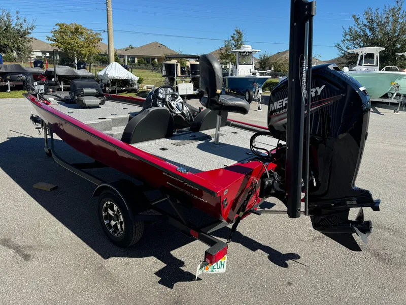 Slide: The Image of 2020 Bass Tracker 175 TF boat with Mercury engine, parked outdoors. - 13