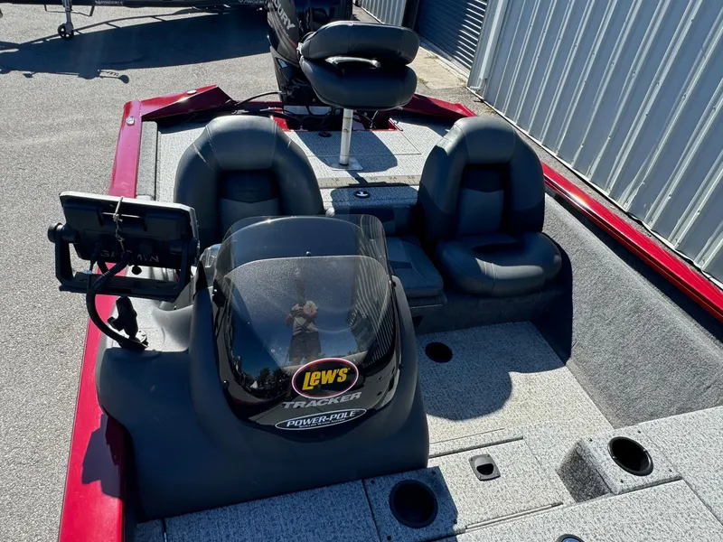 Slide: The Image of 2020 Bass Tracker 175 TF boat interior with seating and control panel. - 6