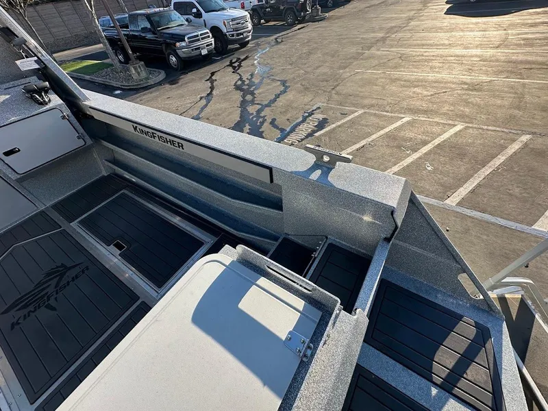Slide: The Image of 2025 KingFisher 2625 Coastal Express boat interior with parking lot view. - 15