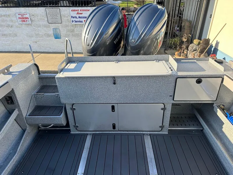 Slide: The Image of 2025 KingFisher 2625 Coastal Express boat deck with dual outboard motors. - 18