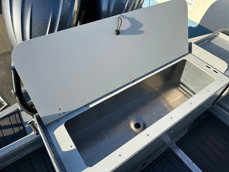 Slide: The Image of Open storage compartment on 2025 KingFisher 2625 Coastal Express boat. - 19