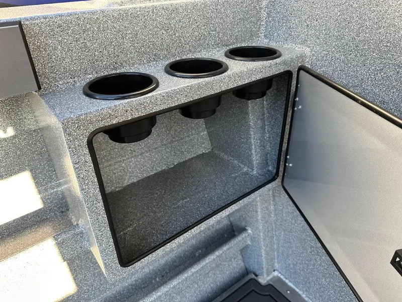 Slide: The Image of Interior of 2025 KingFisher 2625 Coastal Express boat with cup holders and storage compartment. - 29