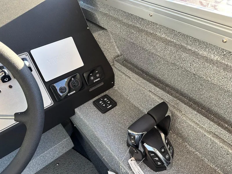 Slide: The Image of Interior of 2025 KingFisher 2625 Coastal Express boat cockpit with controls and steering wheel. - 39