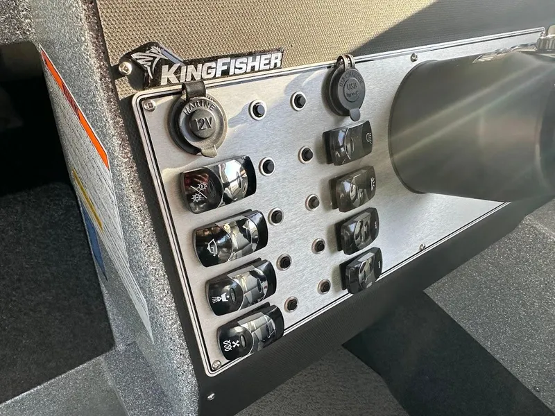Slide: The Image of Control panel of 2025 KingFisher 2625 Coastal Express boat with switches and outlets. - 40