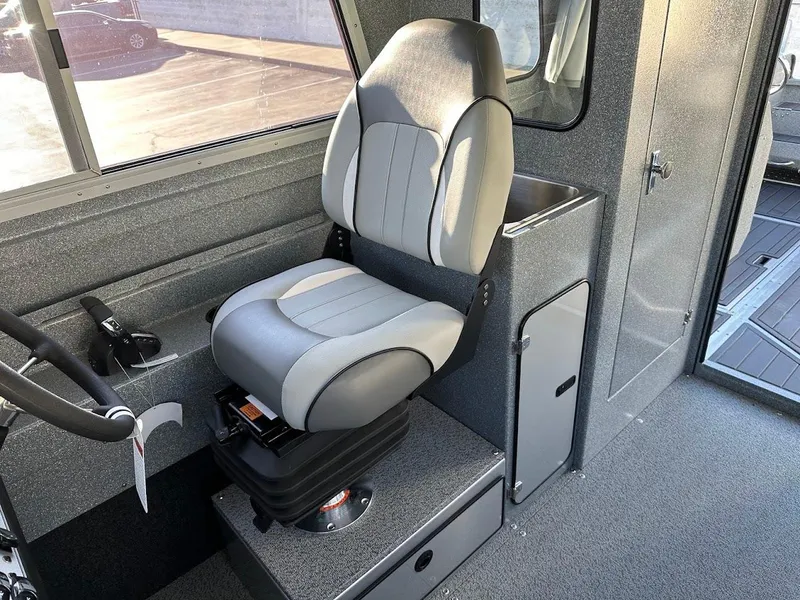 Slide: The Image of 2025 KingFisher 2625 Coastal Express interior with a comfortable captain's chair. - 41