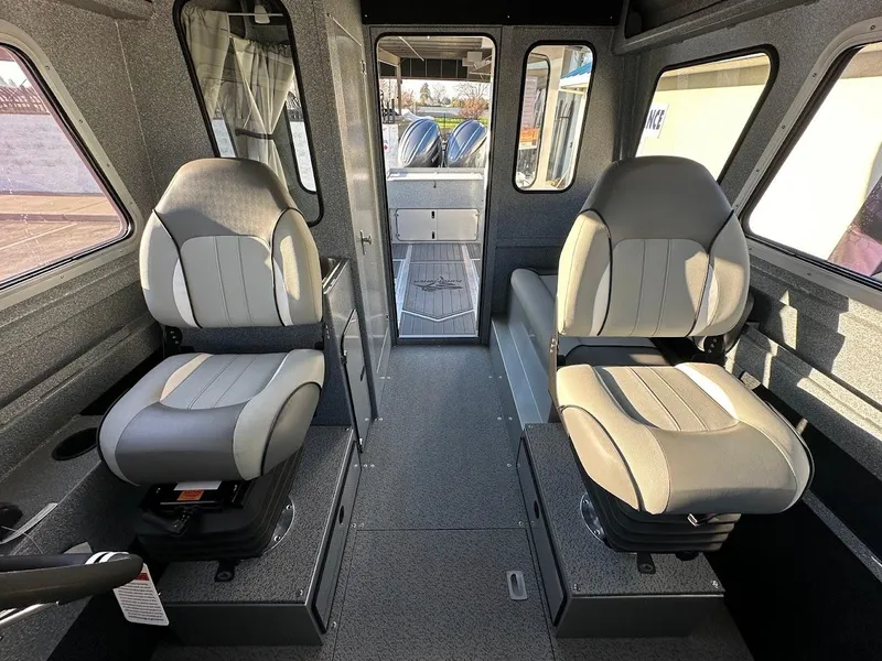 Slide: The Image of Interior of 2025 KingFisher 2625 Coastal Express boat with two cushioned seats. - 48