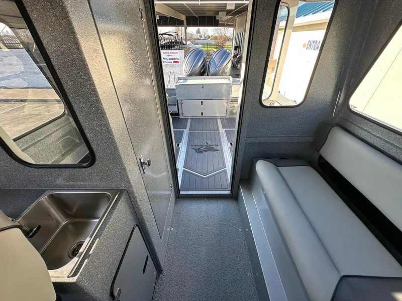 Slide: The Image of Interior of 2025 KingFisher 2625 Coastal Express boat with seating and sink. - 49