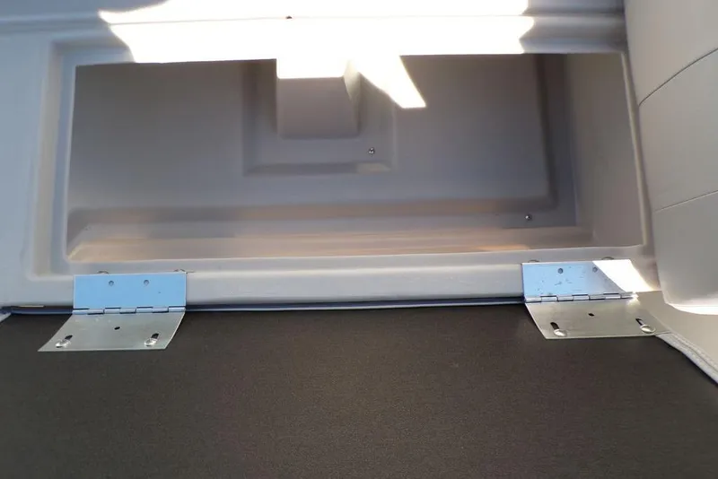 Slide: The Image of Storage compartment of 2025 Godfrey Xperience 2286 SBX Sport Tube boat, featuring metal hinges. - 14