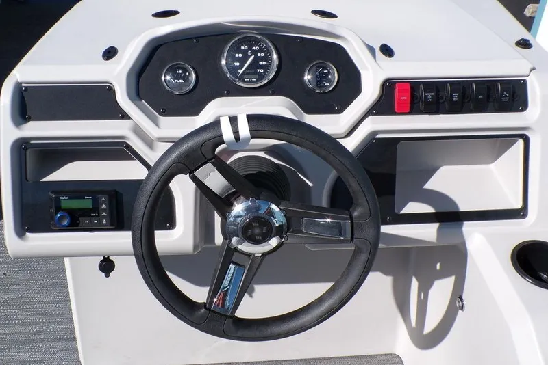Slide: The Image of Steering console of 2025 Godfrey Xperience 2286 SBX Sport Tube boat, featuring gauges and controls. - 17