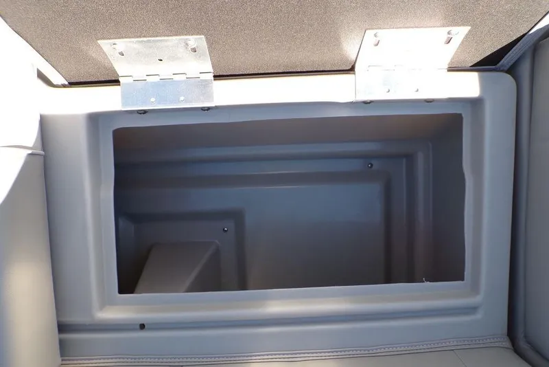 Slide: The Image of Open storage compartment in 2025 Godfrey Xperience 2286 SBX Sport Tube boat. - 19