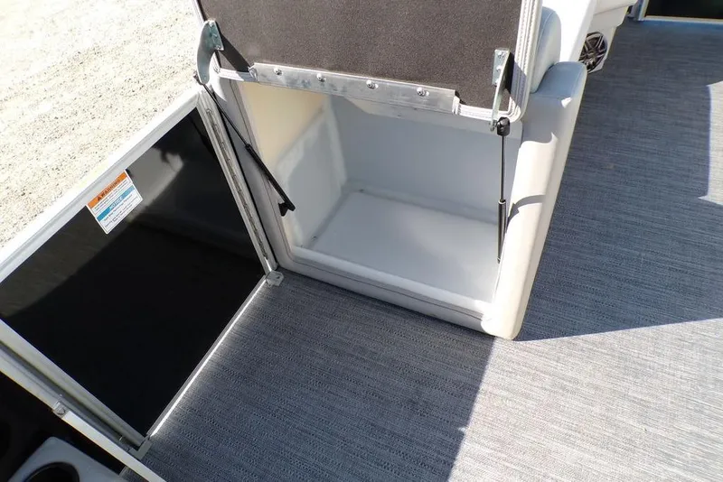Slide: The Image of Open storage compartment on 2025 Godfrey Xperience 2286 SBX Sport Tube boat. - 26