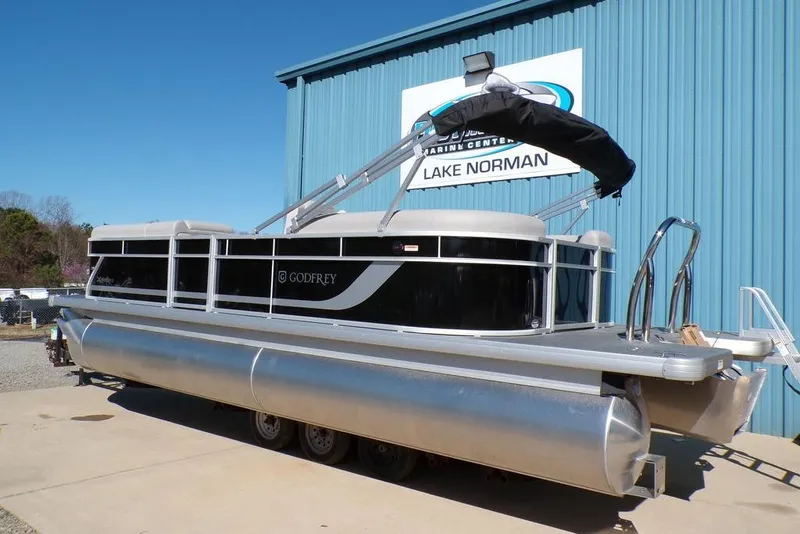 Slide: The Image of 2025 Godfrey Xperience 2286 SBX Sport Tube pontoon boat at Lake Norman dealership. - 5