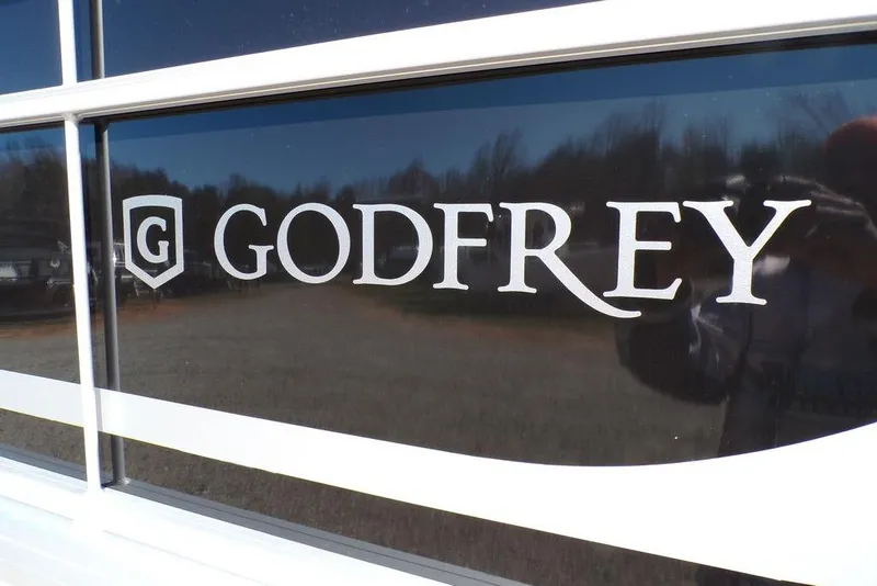 Slide: The Image of Godfrey logo on 2025 Xperience 2286 SBX Sport Tube boat exterior. - 6