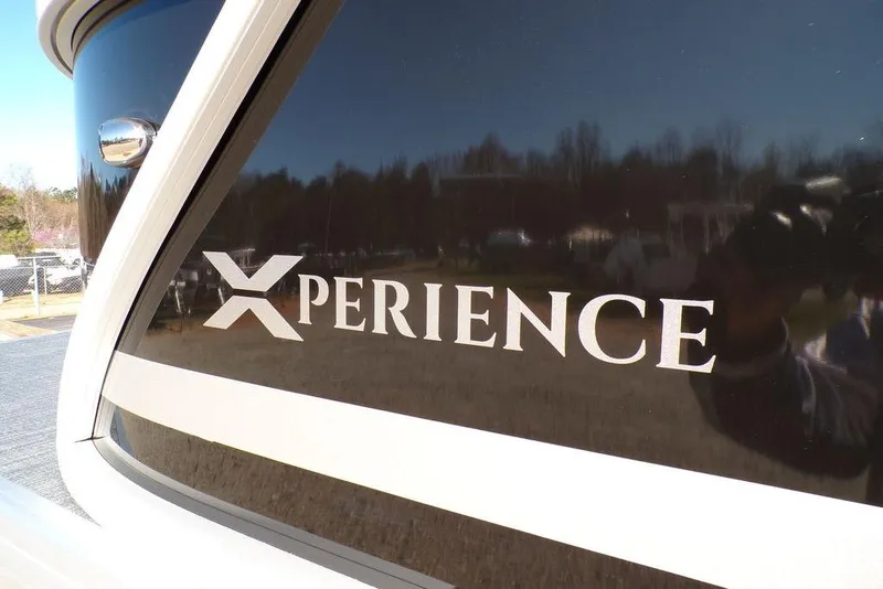 Slide: The Image of 2025 Godfrey Xperience 2286 SBX Sport Tube, sleek design with reflective surface. - 7