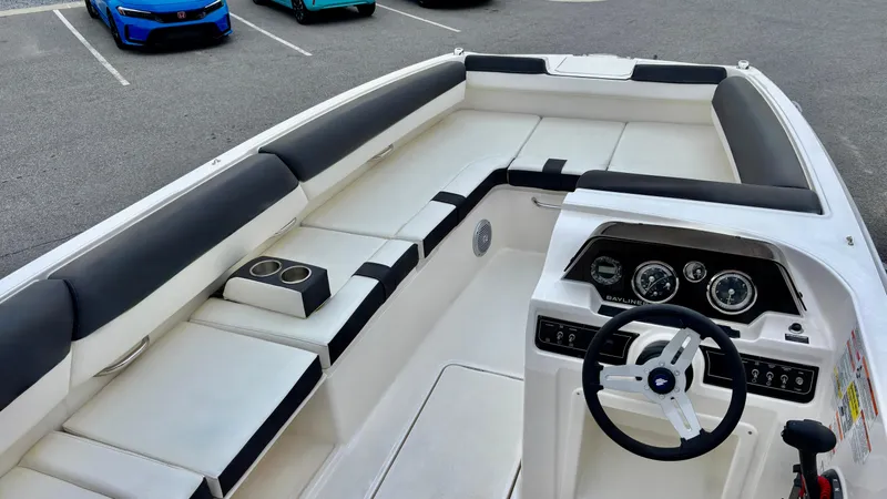 Slide: The Image of 2025 Bayliner D20 boat interior with sleek seating and modern dashboard. - 4