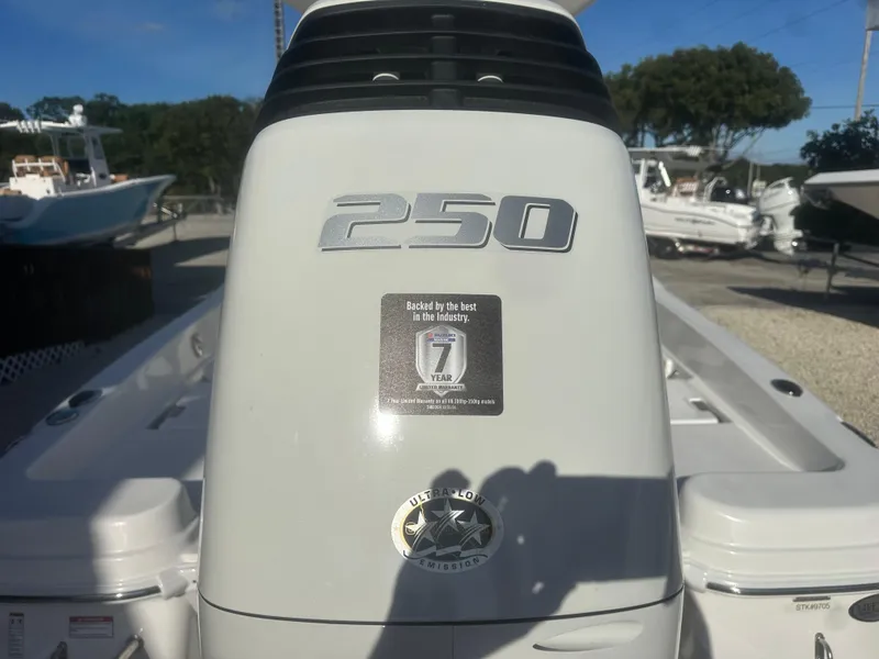 Slide: The Image of NauticStar 231 Hybrid 2025 boat engine with 250 horsepower, outdoor display. - 10