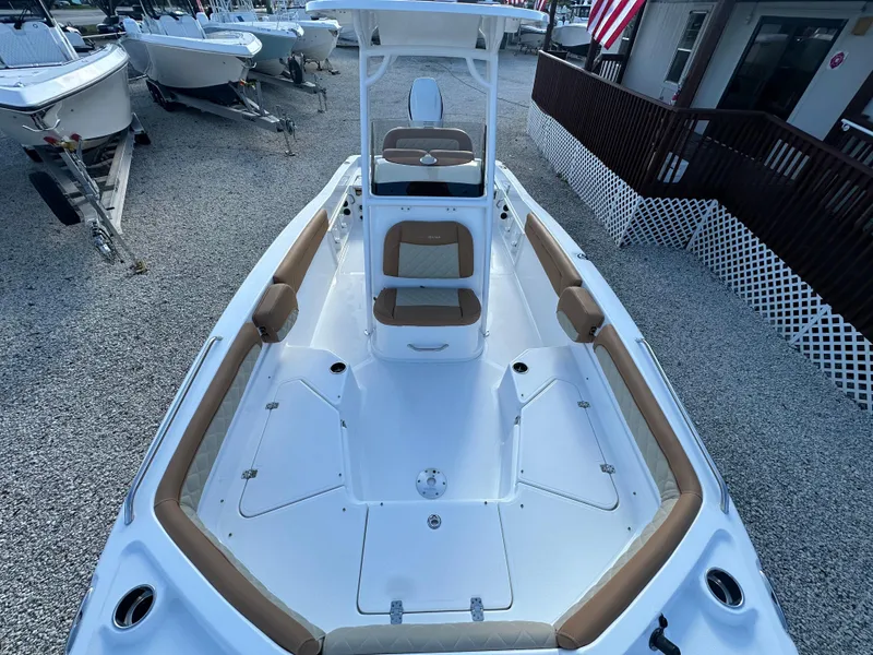 Slide: The Image of 2025 NauticStar 231 Hybrid boat with spacious seating and sleek design. - 13