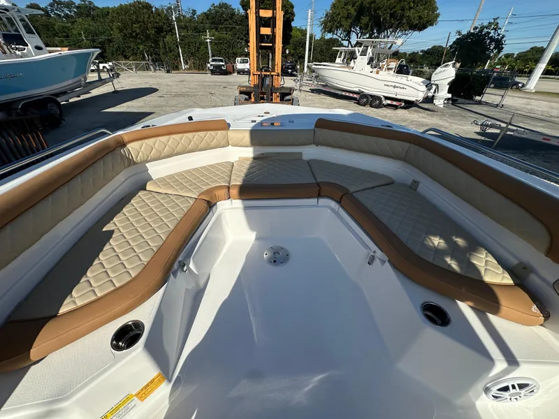 Slide: The Image of 2025 NauticStar 231 Hybrid boat with spacious seating and modern design. - 16