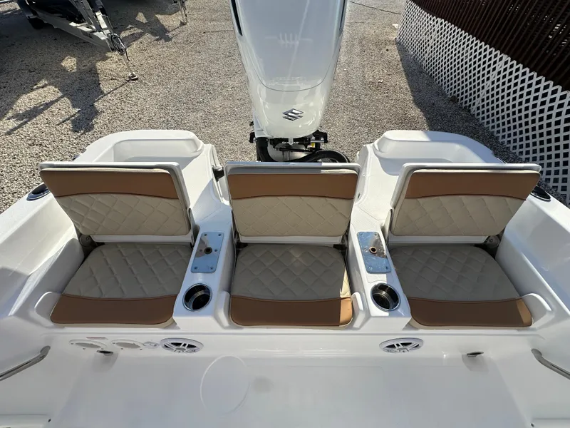 Slide: The Image of 2025 NauticStar 231 Hybrid boat seats with beige and white upholstery. - 27
