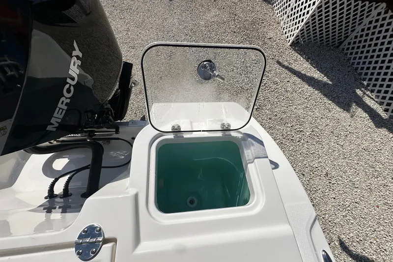 Slide: The Image of 2024 NauticStar 22XS boat with Mercury engine and open livewell. - 20